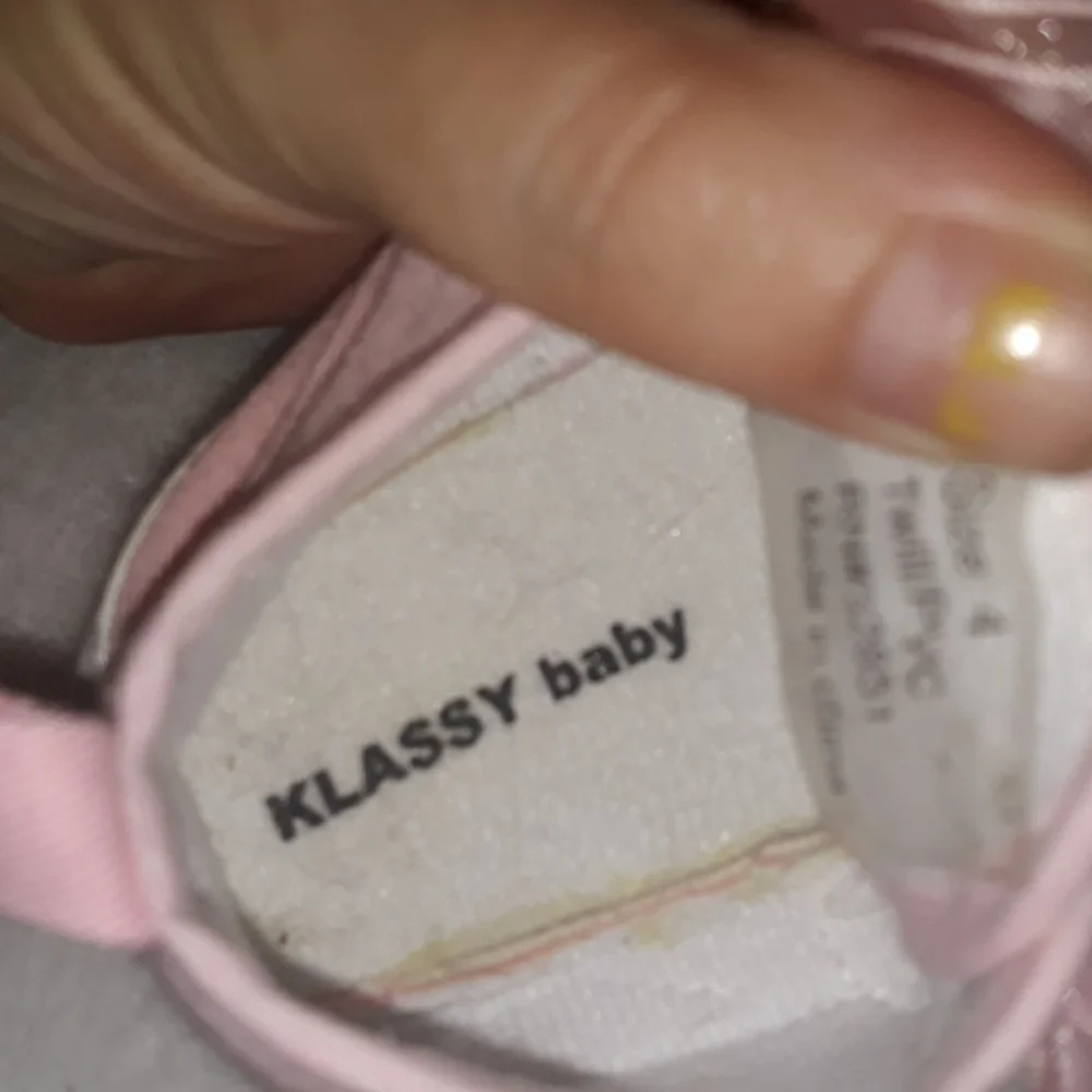 Pink baby sneakers with moon and star beaded accents and fun laces